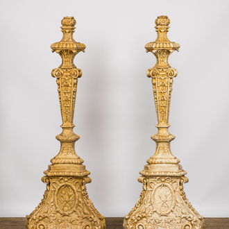 A pair of imposing patinated and gilt church candlesticks, 20th C.