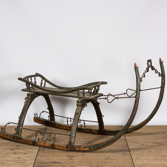 A wrought iron-mounted green-painted wooden sleigh, 19th C.