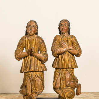A pair of polychromed and gilt wooden figures of kneeling and praying angels, ca. 1700