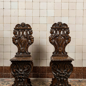 A pair of Italian wooden 'sgabello' chairs with a mascaron, 19th C.