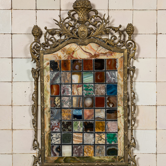 A pietra dura plaque mounted in a brass frame, 20th C.