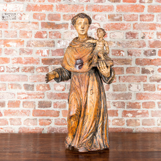 A polychrome wooden Saint Anthony holding the Child Jesus, 17th C.