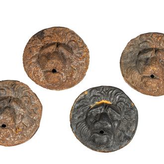 Four cast iron medallions with a lion's head, 19th C.