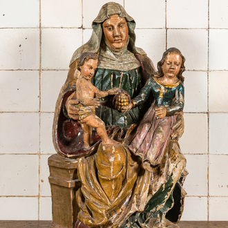 A polychromed wooden Saint Anne Trinity with pomegranate group, 17th C.