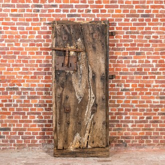 A wooden door with wrought iron lock and hinges, 17/18th C.