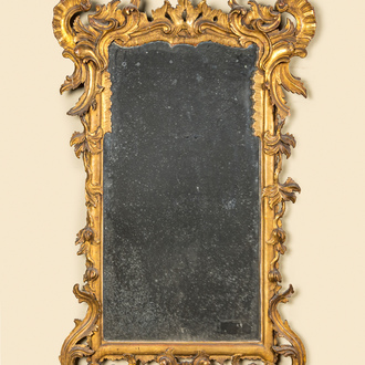 A French finely carved gilt wooden Régence mirror, 18th C.