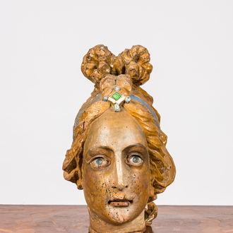 A polychrome wooden head of a female saint, 18th C.