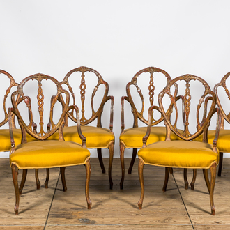 Six English polychrome and partly gilt George Hepplewhite style armchairs, 19th C.