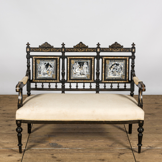 An English ebonised wooden sofa with mother-of-pearl inlaid and three Minton Waverley plaques by John Moyr Smith (1839-1912), 19th C.