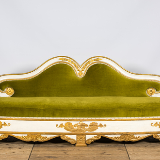 A neoclassical style gilt and patinated wooden sofa, 19th C.