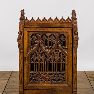 An attractive reticulated gothic wooden panel mounted in a Gothic Revival cabinet, 16th and 19th C.