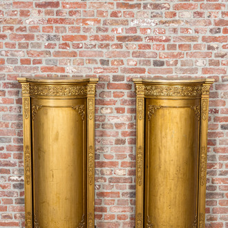 A pair of gilt wooden Empire-style demi-lune cabinets, ca. 1900