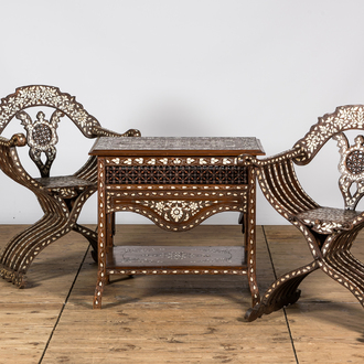 Two Indian dagobert chairs and a coffee table with mother-of-pearl inlay, 20th C.