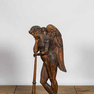 A large wooden relief with an angel resting on his trumpet, 18th C.