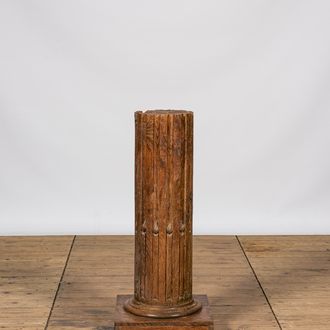 A wooden pedestal in the shape of a fluted column, 19th C.