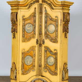 A German patinated wooden two-door cabinet with relief design and monogram R.K., 19th C.