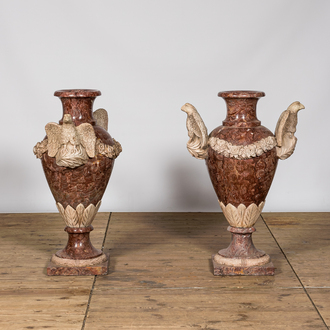 A pair of imposing marble 'eagles' vases, 20th C.