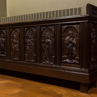 A carved oak panel with saints mounted as a heating frame, 19/20th C.