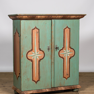 A polychrome wooden two-door cabinet with inside landscape design, 19th C.