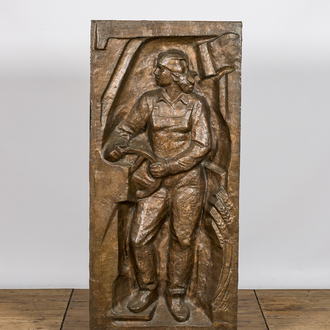 An impressive large communist subject bronze relief of a factory worker, possibly Eastern Europe, 3rd quarter 20th C.