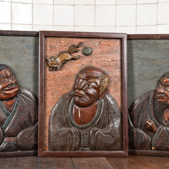 Three Japanese lacquered carved wooden panels, Meiji, 19th C.