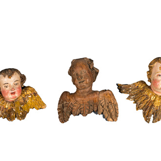 Three Flemish wooden angel heads, two of them with polychrome design, 17/18th C.