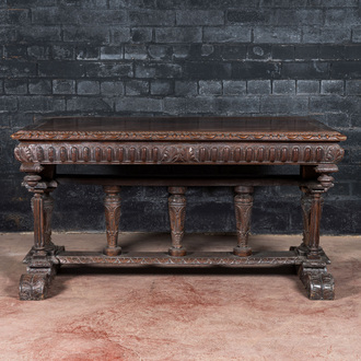 A French walnut table in Henri II-style