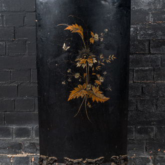 A black-lacquered metal screen on lions' feet with floral decoration in Napoleon III-style, 19th C.