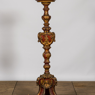 An Italian polychrome and gilt wooden church candlestick, 18th C