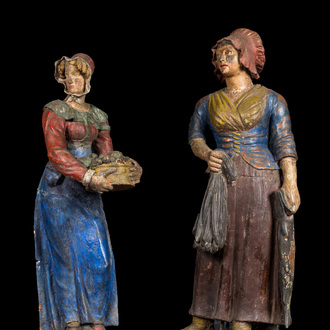 A pair of large polychrome terracotta figures of a fish- and fruit seller, 19th C.