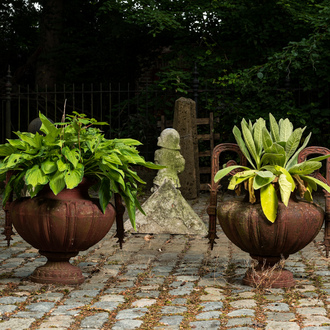 A pair of cast iron garden vases, 20th C.