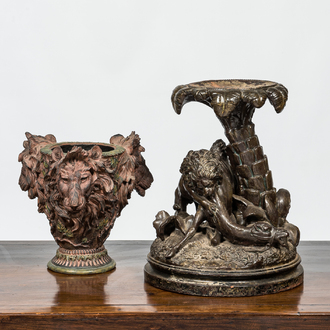 A faux bronze pottery group of a lion killing a camel and a patinated plaster jardinière with lion's heads, 19th C.