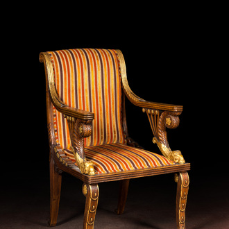 A French partly gilt wooden arm chair with ram heads, 19th C.