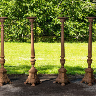 Four large cast iron church candlesticks, 20th C.
