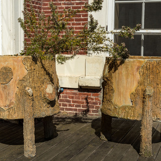 A pair of faux-bois tripod planters, 20th C.