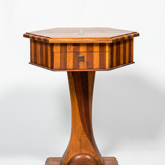 A hexagonal oak wooden and walnut work table on a central base, 19th C.