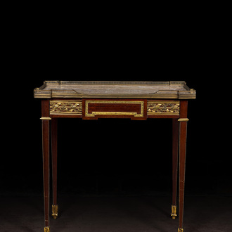 A French Louis XVI-style bronze and brass mounted mahogany side table with marble top, 19/20th C.