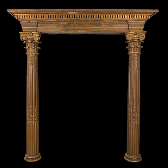 A partly gilt wooden portal with two columns with Ionic capitals, 18/19th C.