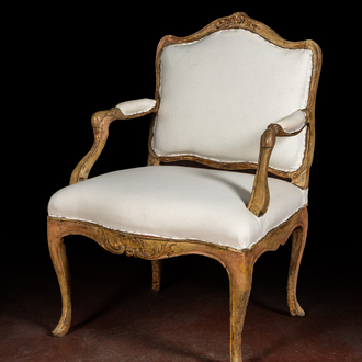 A French patinated wooden Louis XV armchair, 18th C.