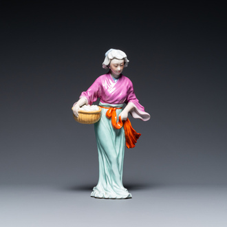 A Chinese porcelain Cultural Revolution figure of a lady with a laundry basket, 20th C.