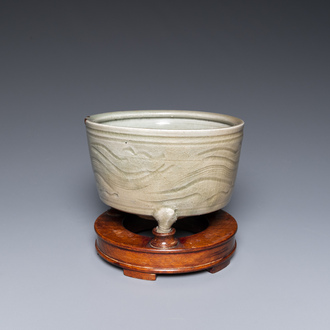 A Chinese Longquan tripod censer with kintsugi repair on wooden stand, Ming