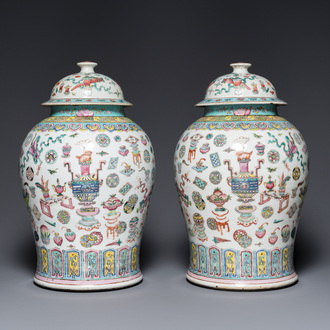 A pair of Chinese famille rose 'antiquities' vases and covers, 19th C.