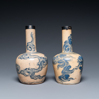 A pair of Vietnamese Bat Trang stoneware bottle vases with clouds, 19th C.