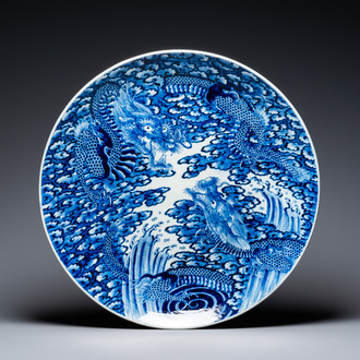 An exceptionally large Japanese blue and white Arita 'dragon' dish, 19th C.