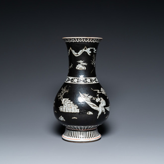 A Chinese famille noire vase with grisaille and iron-red design, 19th C.