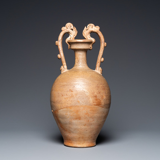 A Chinese straw-glazed stoneware amphora with dragon handles, Tang