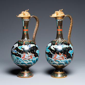 A pair of Chinese cloisonné 'mythical beasts' ewers with zoomorph gilt covers, Qing