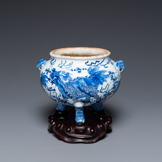 A Chinese blue and white 'mythical beasts' tripod censer, 19th C.