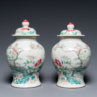 A pair of fine Chinese famille rose vases and covers, 19th C.