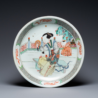 A Chinese famille verte dish with a lady and two playing boys, Kangxi